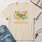 God's Still Working On Me Butterfly T-Shirt