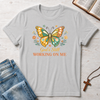 God's Still Working On Me Butterfly T-Shirt